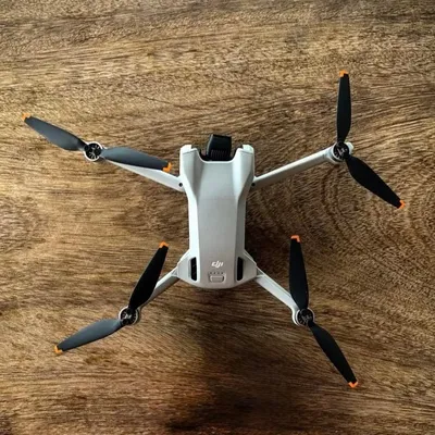 DJI Mini drone on a wooden table
