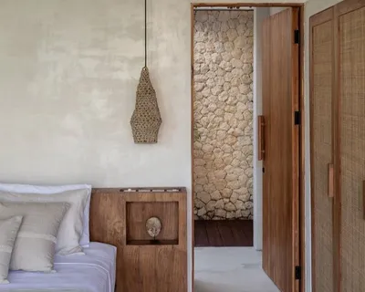 Minimalist room with a wooden door and wall art