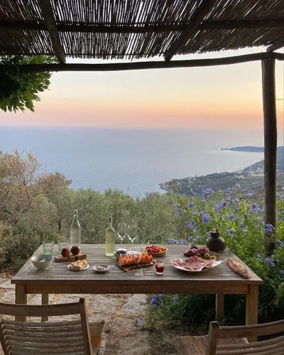 Breakfast table on a terrace overlooking the sea